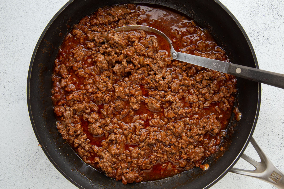 ground beef in a tomato based sauce in a large skillet.