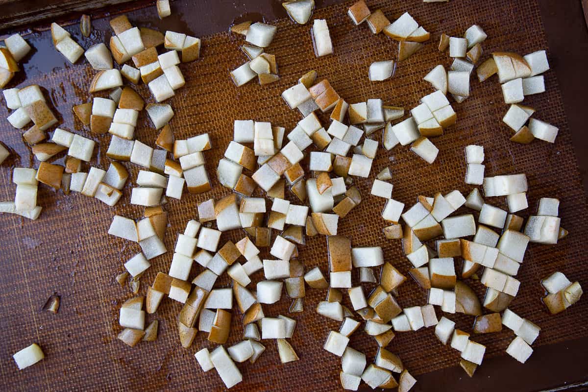 roasted chopped pears on a baking sheet.