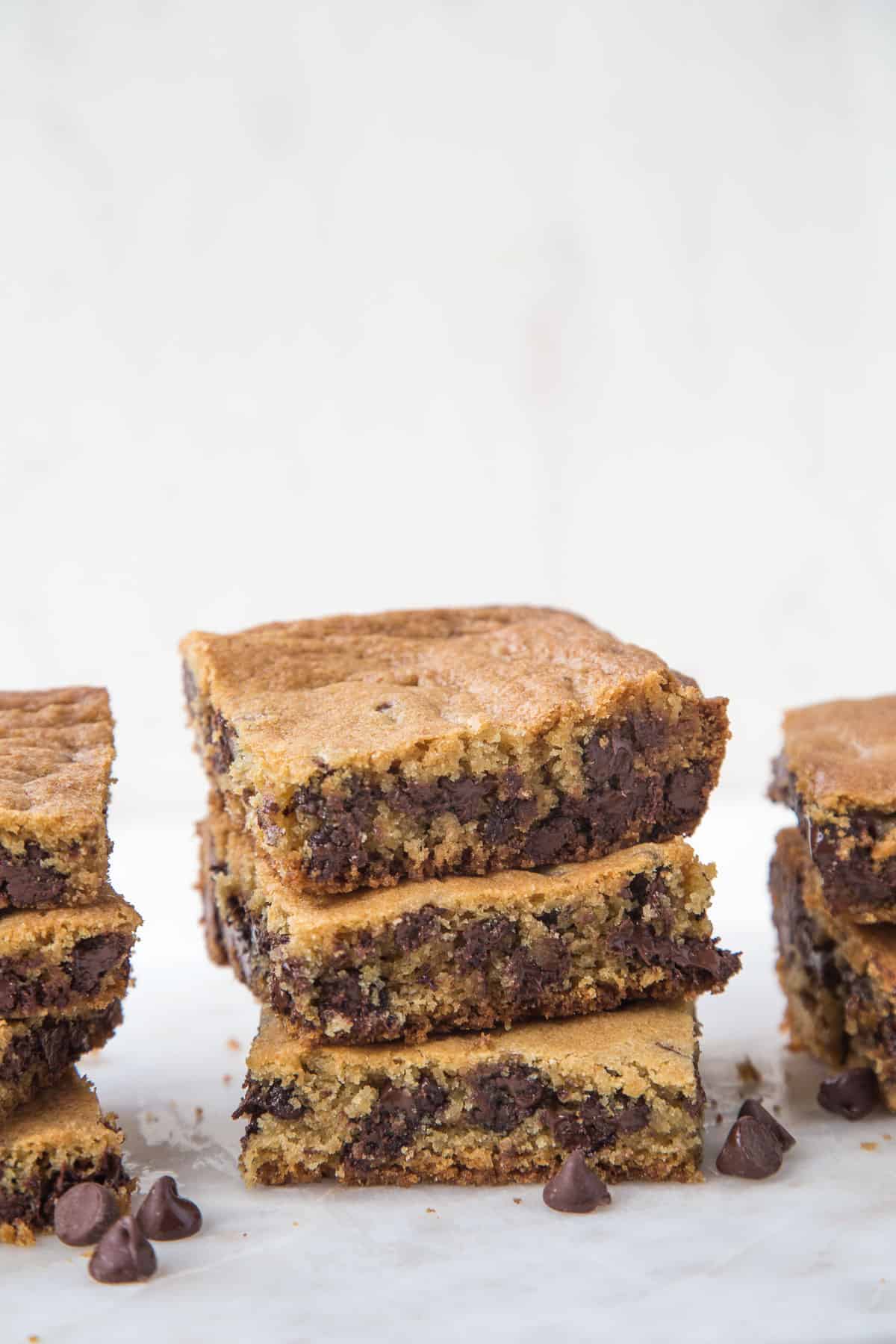 three stacks of toll house cookie bars on a white platter.