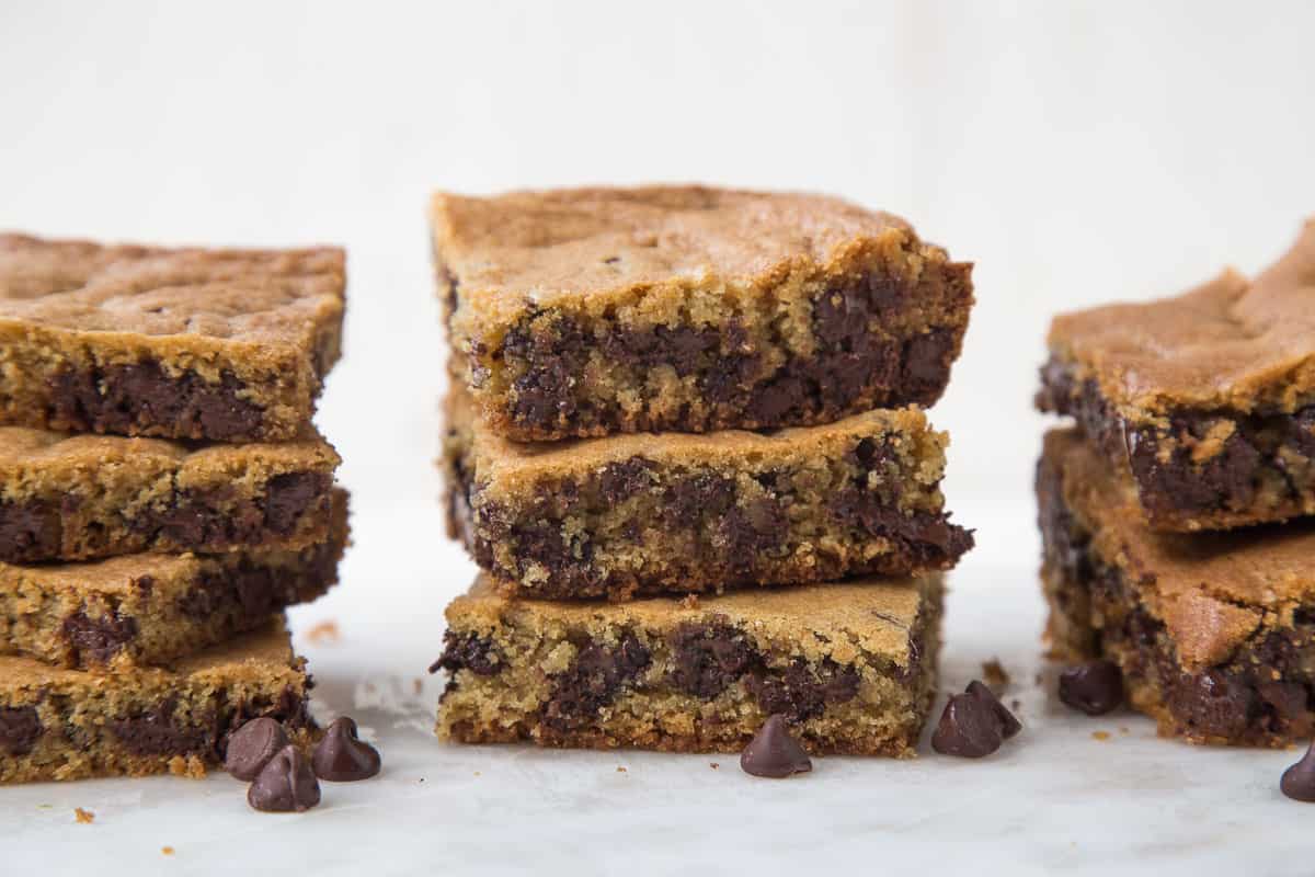 toll house cookie bars stacked in three piles.