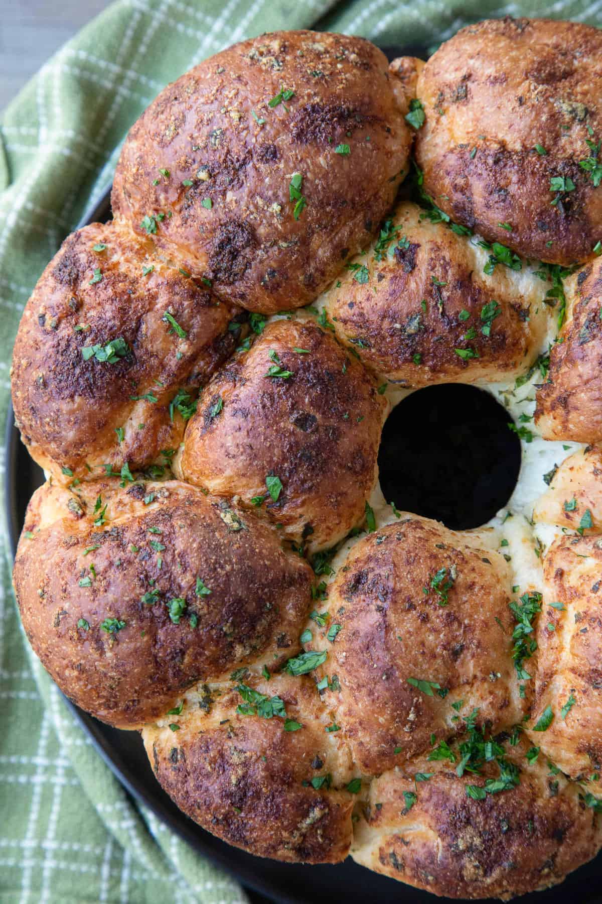 pull apart garlic bread in a tube pan, topped with fresh chopped parsley.