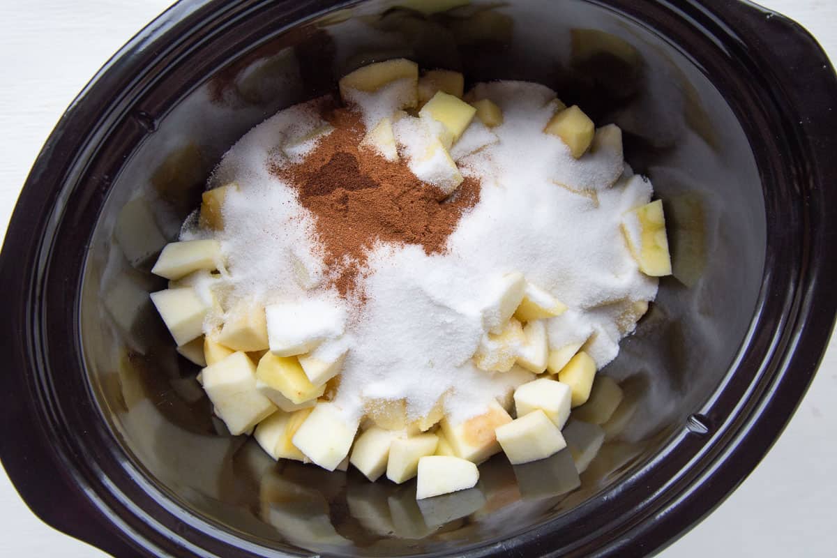 diced apples, sugar, and spices in a crockpot.