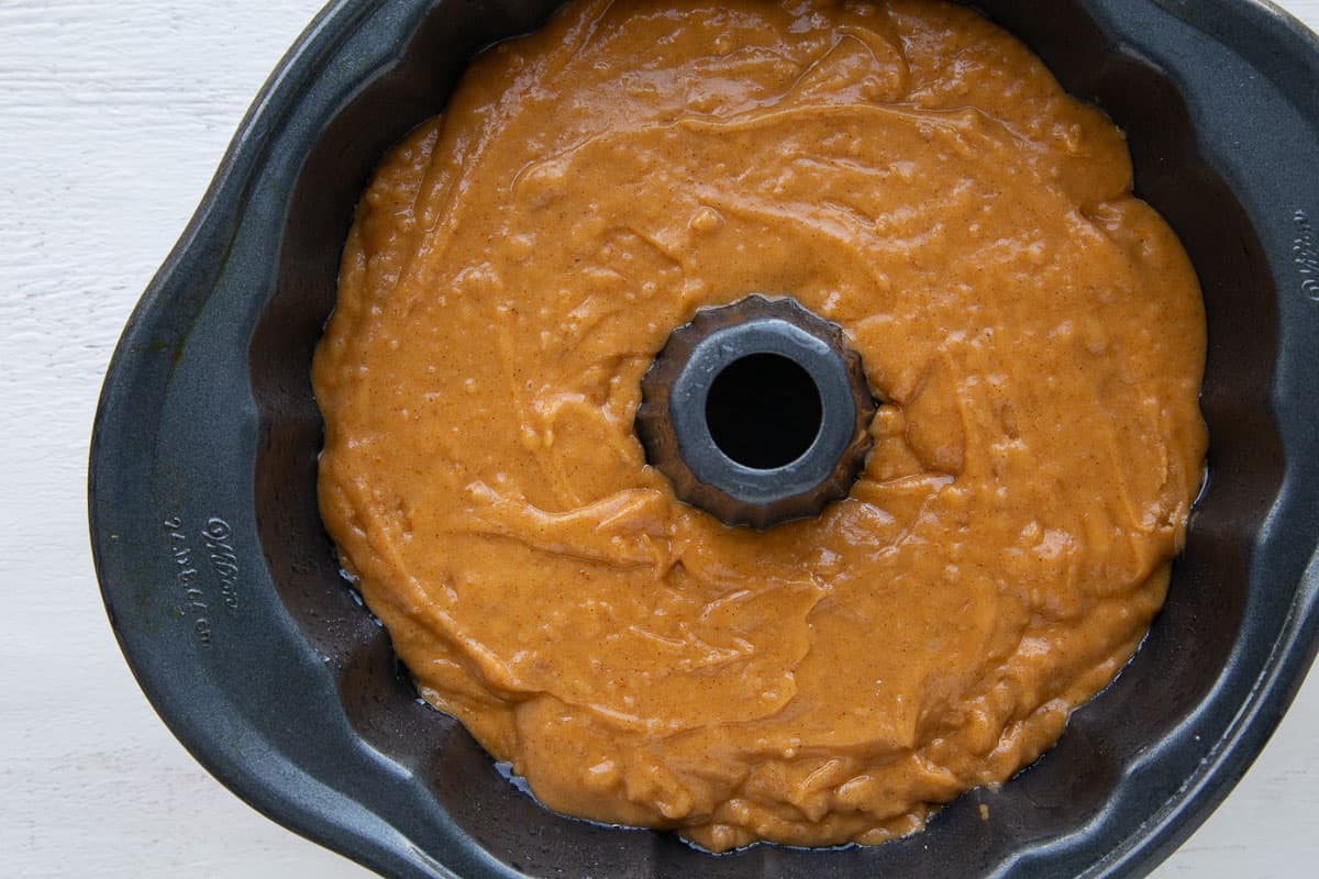 pumpkin cake batter in a bundt pan.