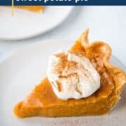 slice of sweet potato pie topped with whipped cream and cinnamon on a white plate.