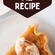 slice of sweet potato pie with a dollop of whipped cream and a sprinkle of cinnamon.