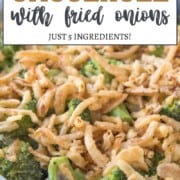 broccoli casserole in a dish topped with fried onions.
