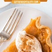 slice of sweet potato pie topped with whipped cream.