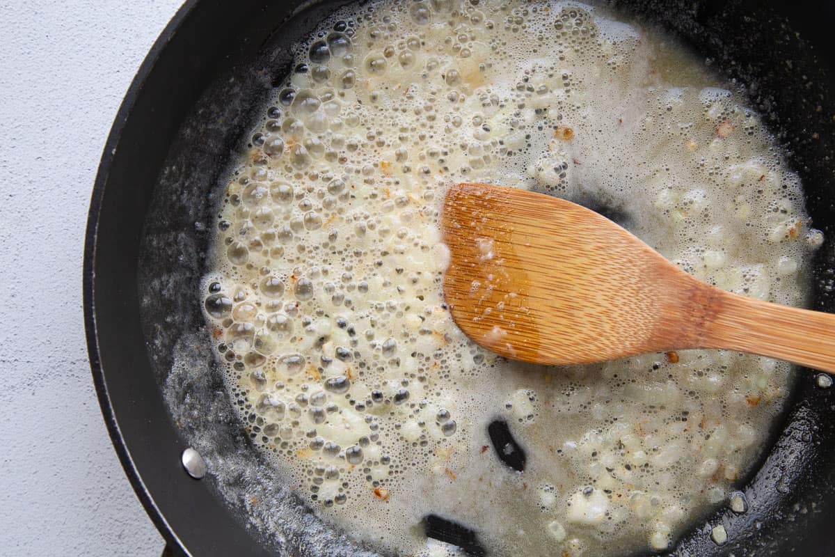 butter, flour, and onion in a large skillet with a wooden spoon.