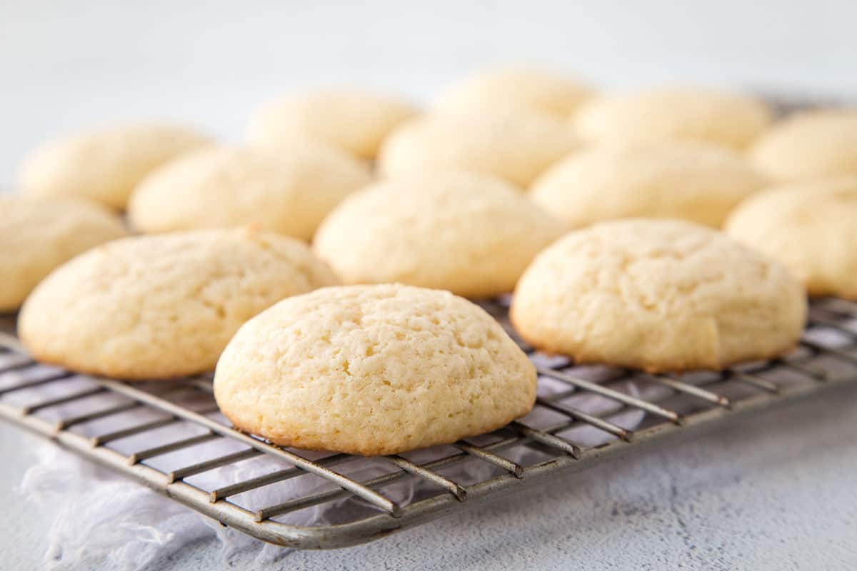 sour cream cookies on a wire rack.