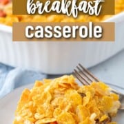 slice of breakfast casserole with hash browns and chopped bell peppers, topped with corn flakes.