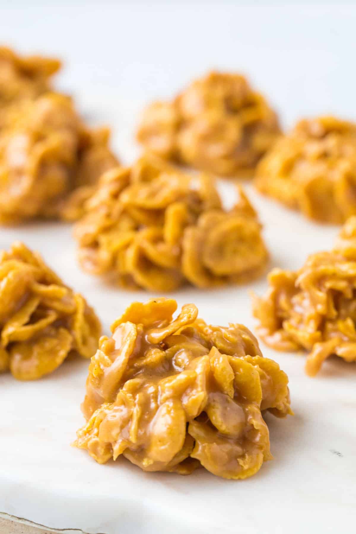 corn flake candy on a white marble tray.