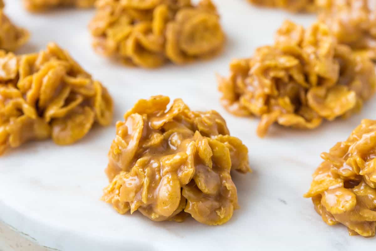 peanut butter corn flake candy on a white tray.