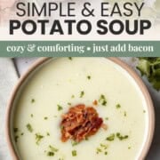bowl of creamy potato soup topped with parsley and chopped bacon