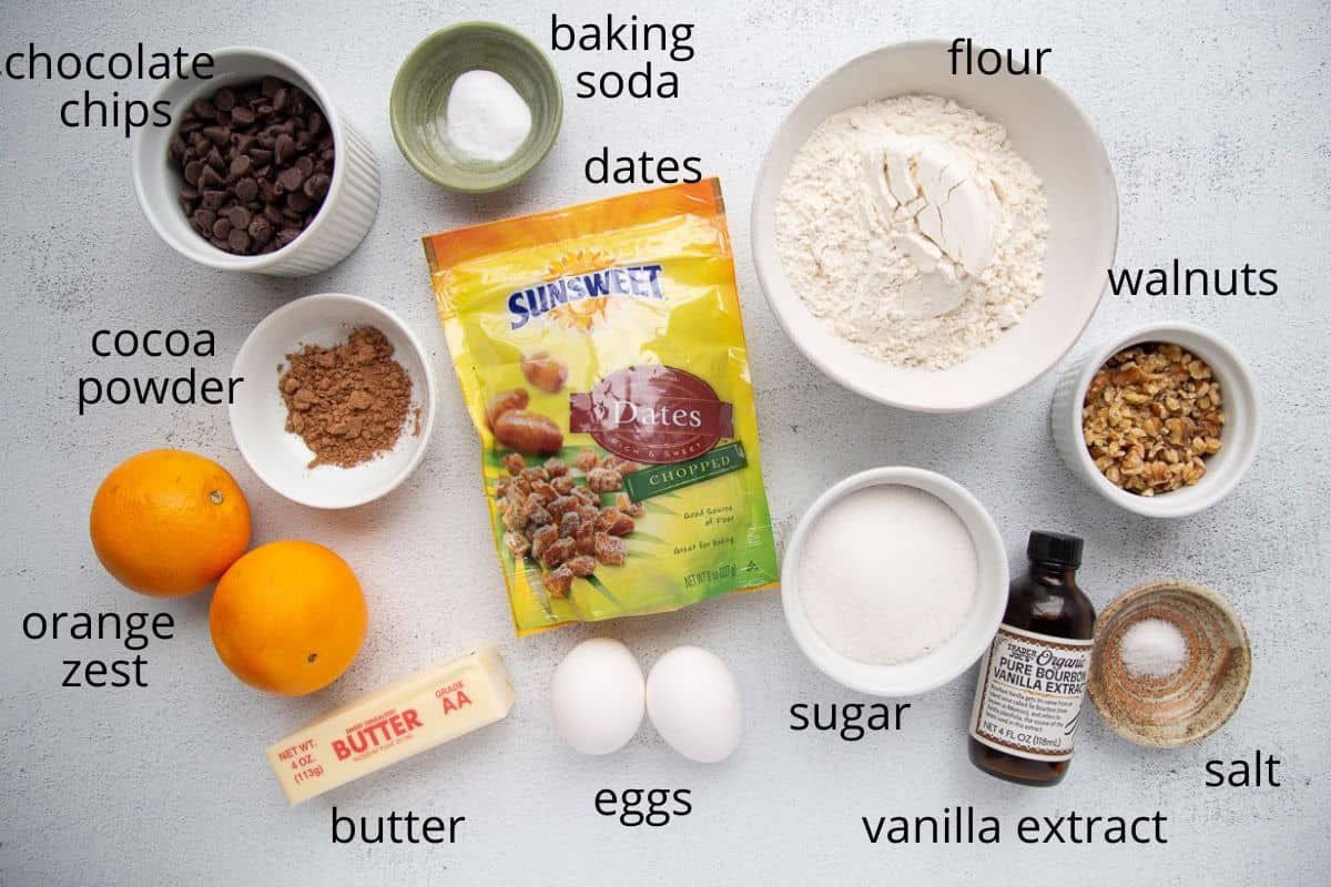 dates, flour, sugar, eggs, and other ingredients on a white table.