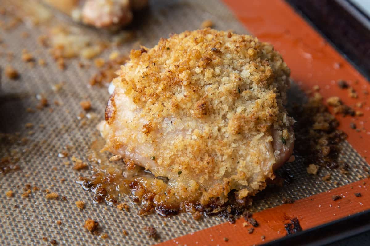 baked ranch chicken thigh on a silicone mat on a sheet pan.