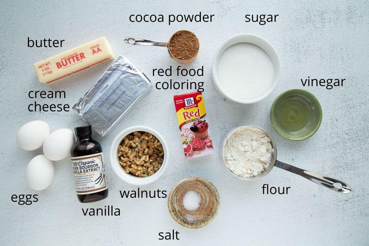 ingredients for red velvet brownies on a white table.