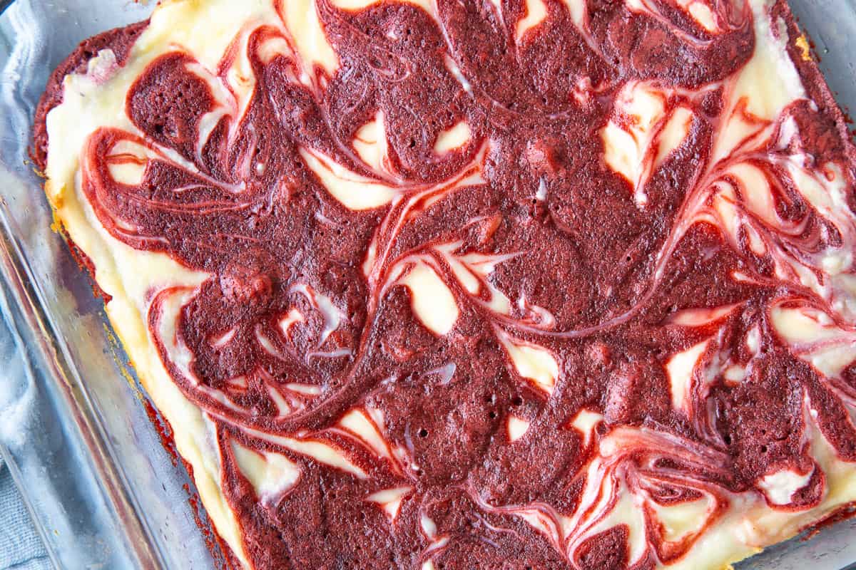 pan of red velvet brownies with a swirled top.