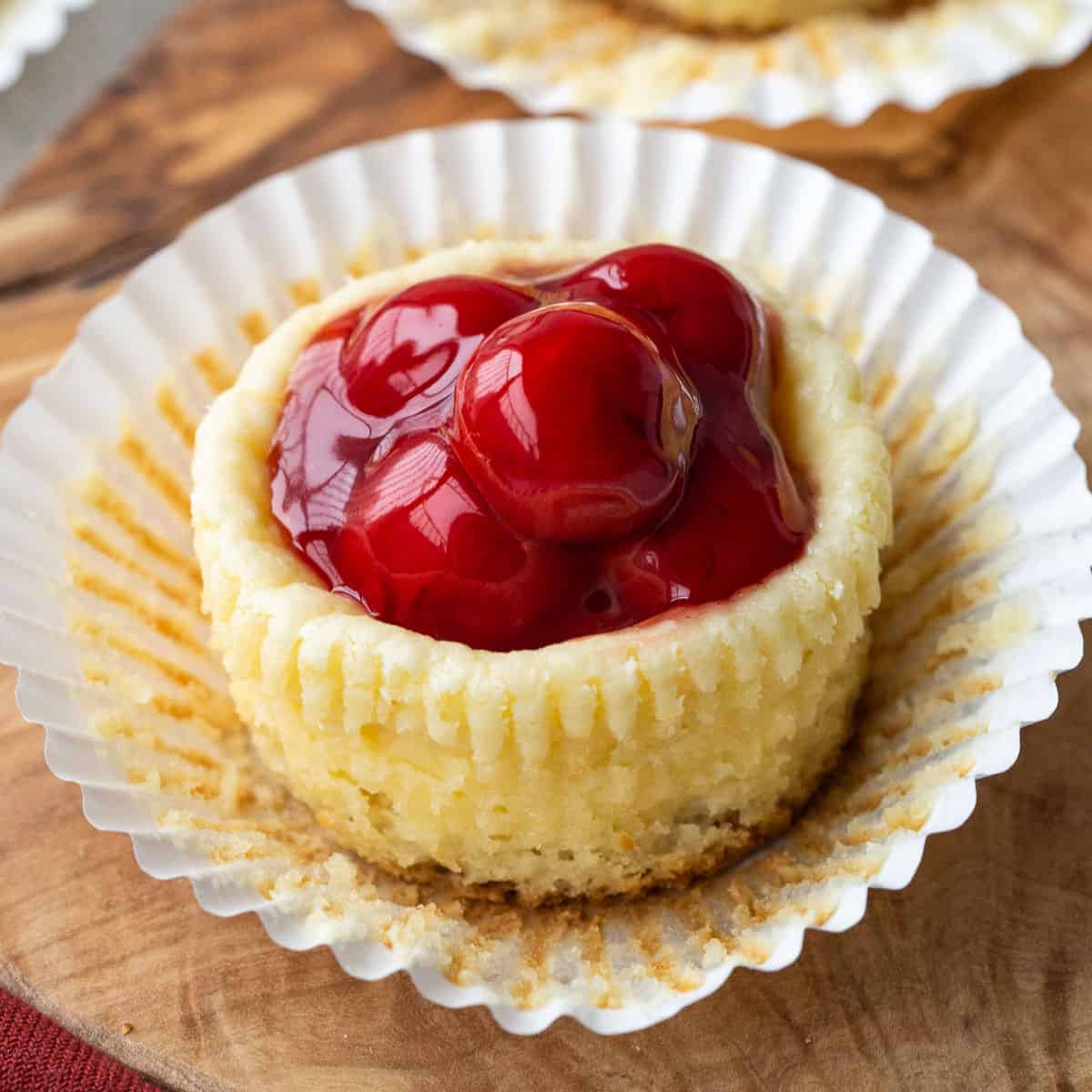 mini cherry cheesecake in a cupcake liner.