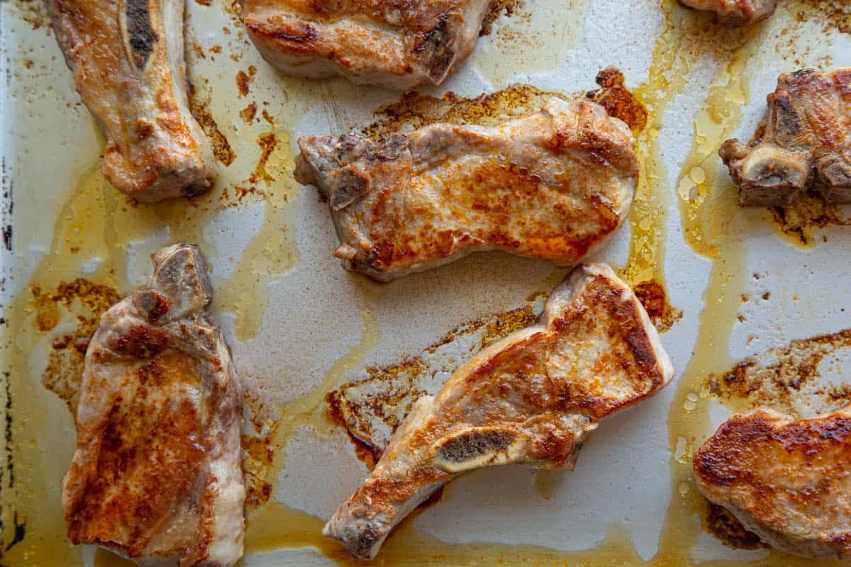 browned country style ribs on a sheet pan.