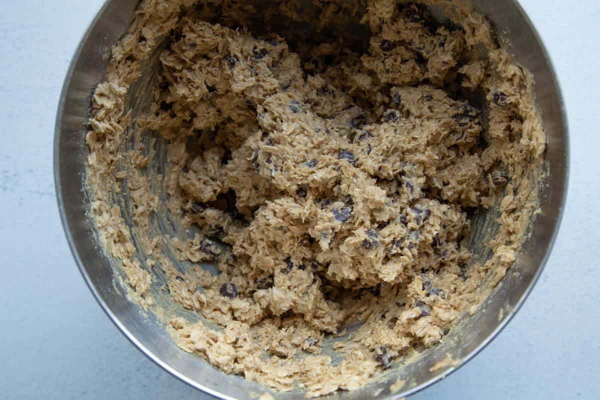 peanut butter oatmeal cookie dough in a metal bowl.