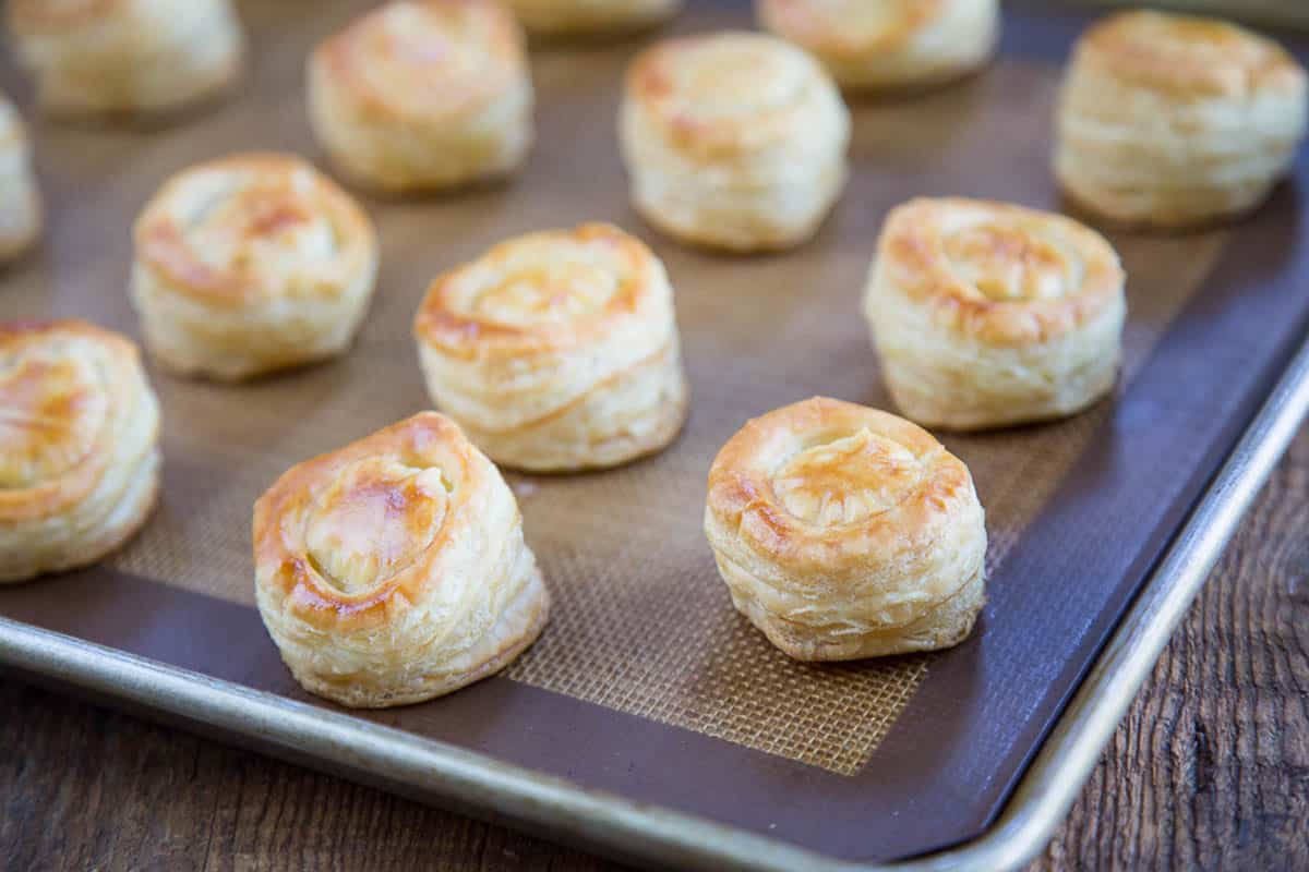puff pastry cups on a baking sheet.
