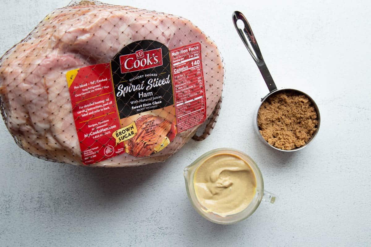 ham, brown sugar, and dijon mustard on a white table.