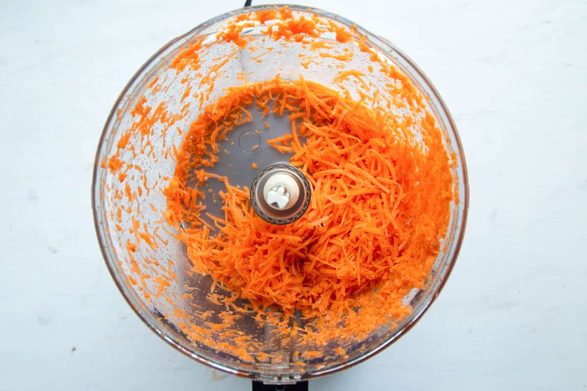 shredded carrots in a food processor.