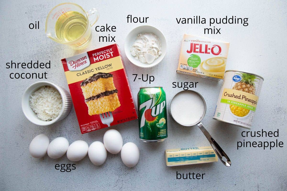 7up, cake mix, eggs, butter, and other cake ingredients on a white table.
