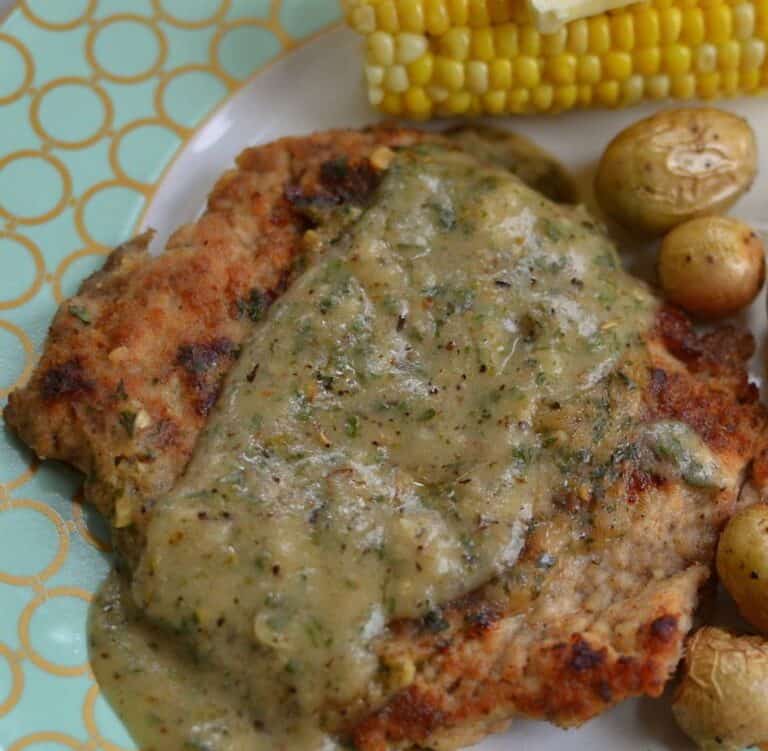 fried pork cube steak topped with a creamy herb gravy. 