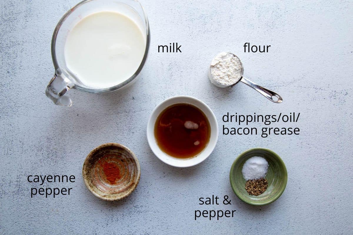 milk, flour, drippings, and other ingredients on a white table.