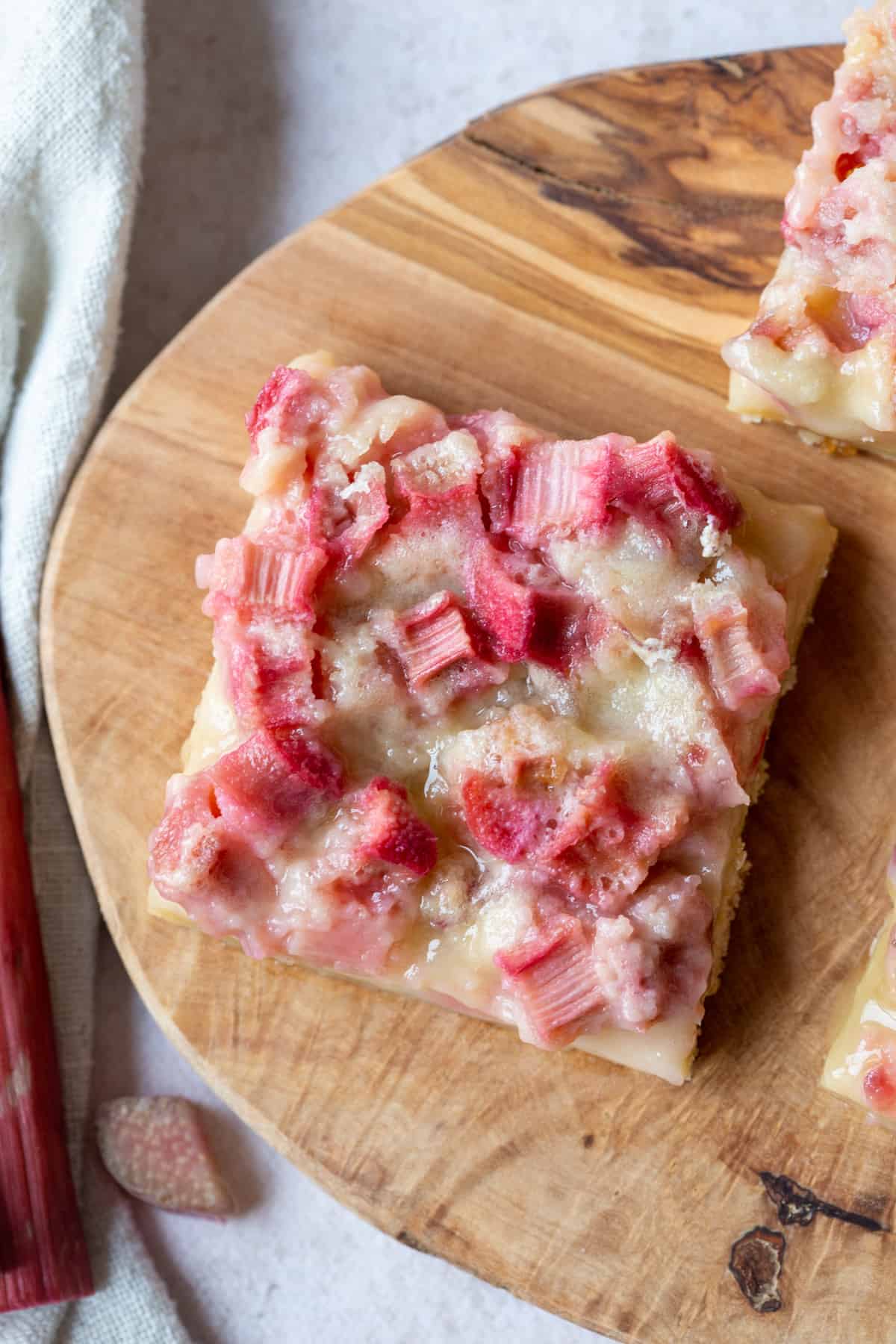 rhubarb bar on a decorative wooden board.