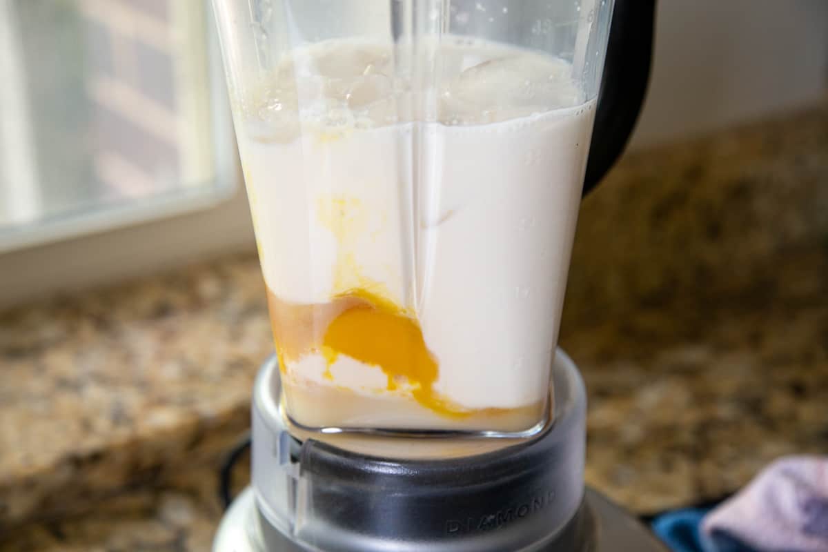 orange juice concentrate and milk in a blender.