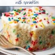 vanilla wacky cake with sprinkles inside and on top, sitting on a white plate with a bite taken out, and a fork in front.