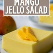 slice of creamy yellow mango jello salad on a plate.