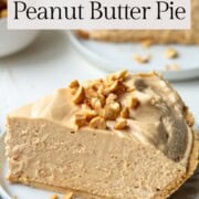 slice of peanut butter pie with peanuts on top.