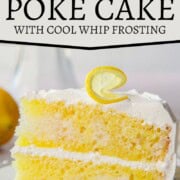 slice of two-layer cake with yellow streaks throughout, topped with a fluffy white whipped topping frosting and a lemon peel garnish.