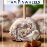 ham pinwheels on a wooden board.