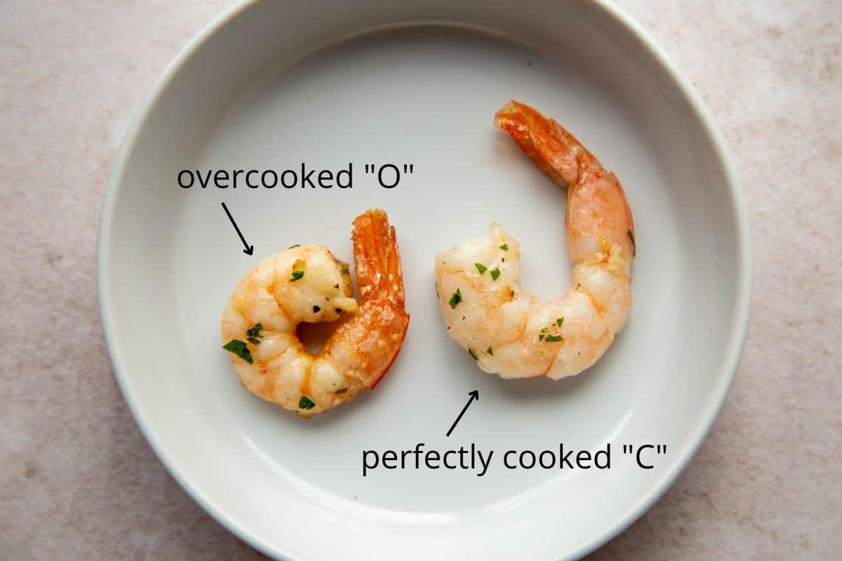 example of overcooked shrimp and perfectly cooked shrimp in a small white dish.