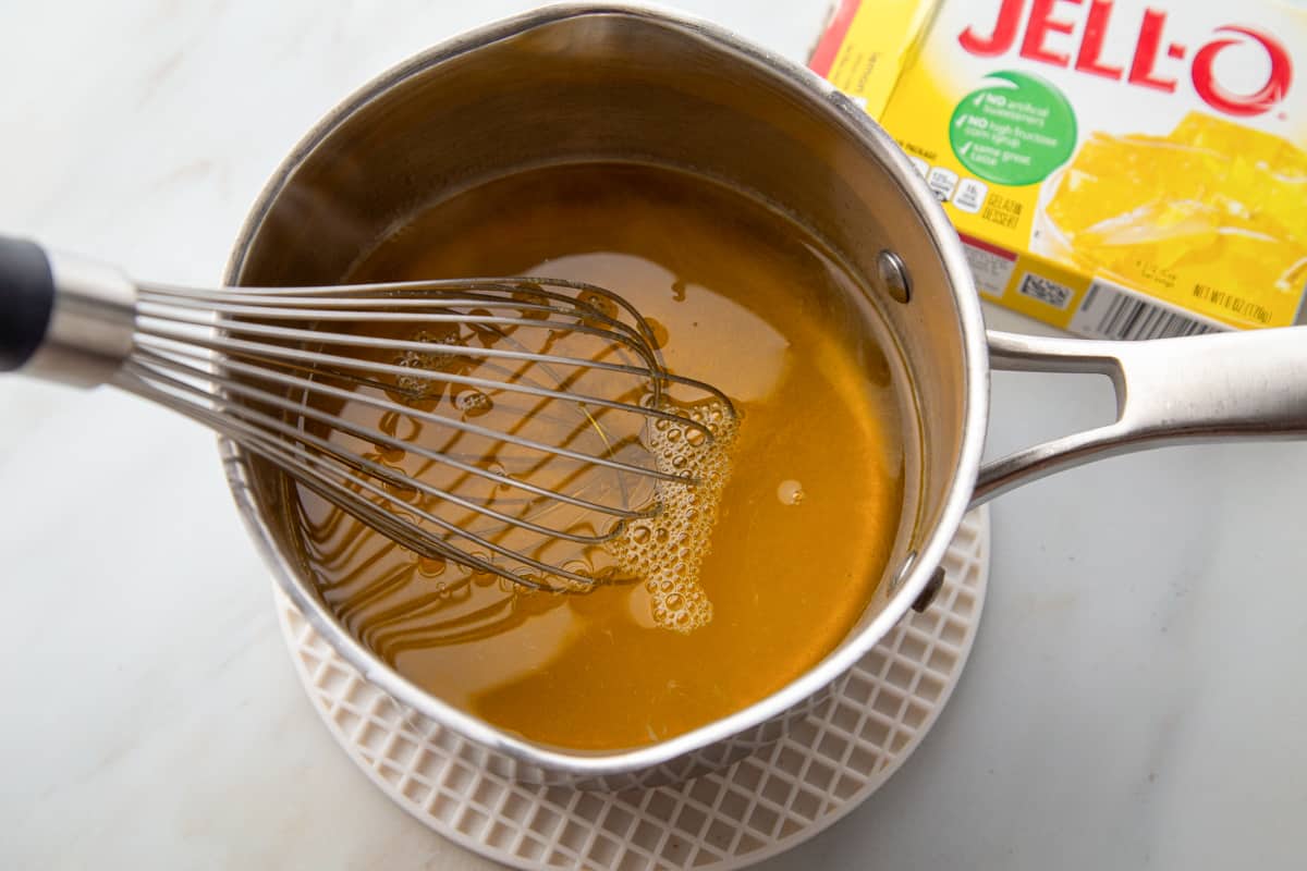 whisk in a saucepan of lemon gelatin and water.