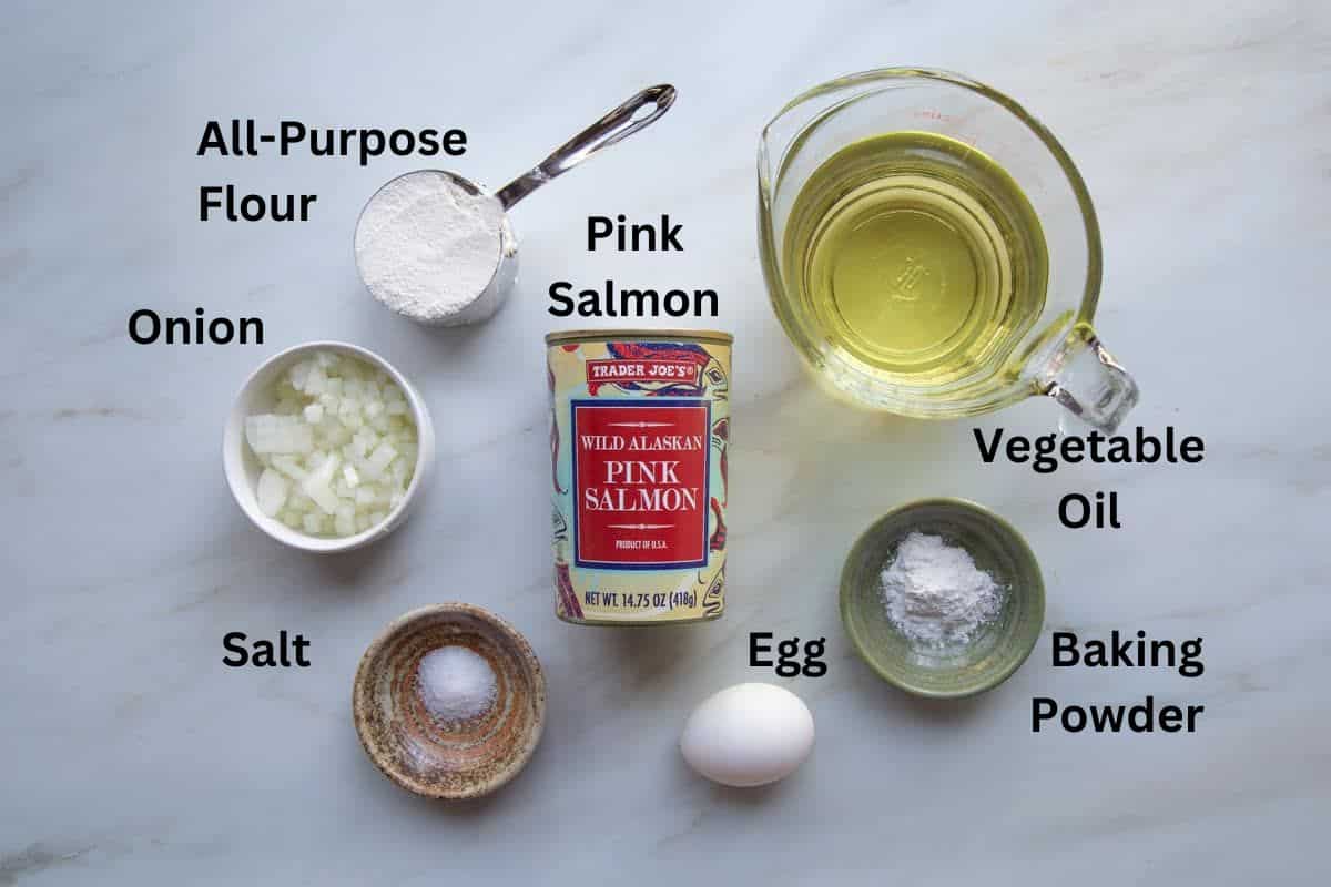 Top view of the ingredients needed to make Salmon Patties with text.