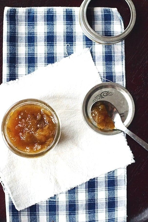 Top view of Cardamom Pear Jar in a small mason jar on a blue and white napkin.