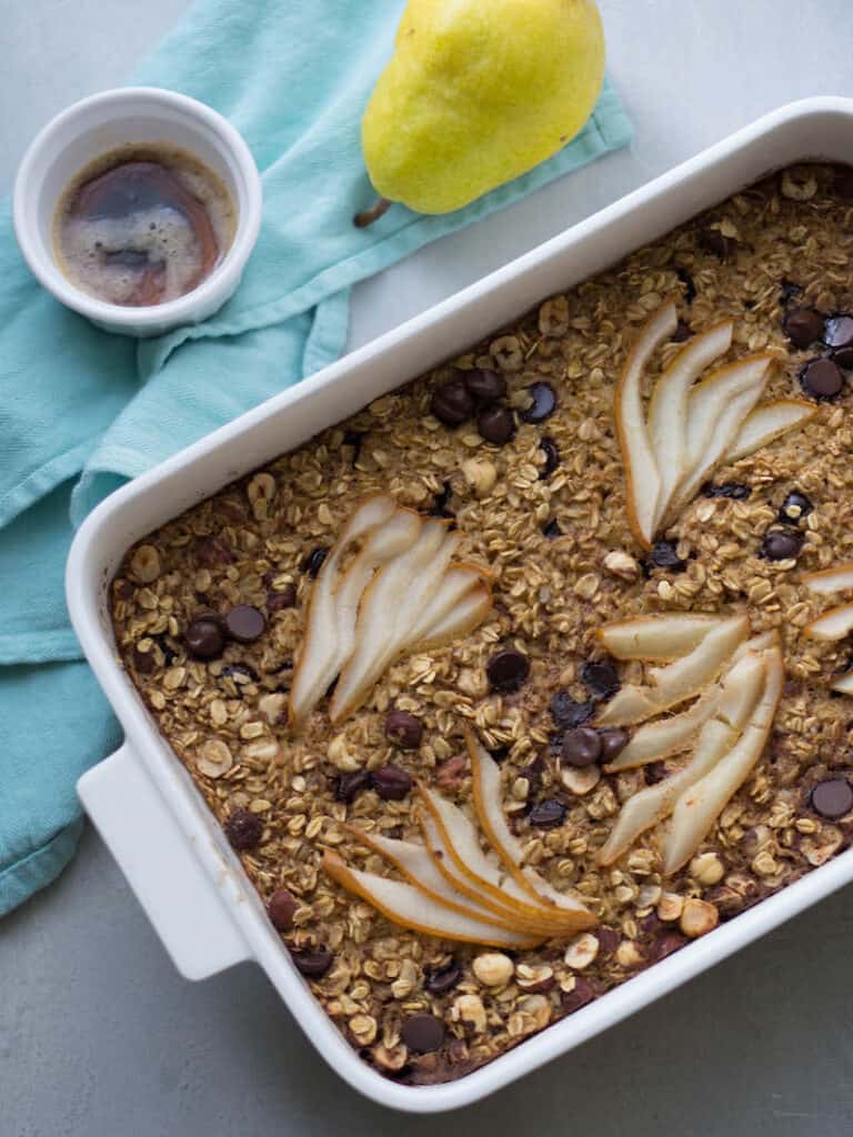 Top view of a baking pan full of Pear and Dark Chocolate Baked Oatmeal.