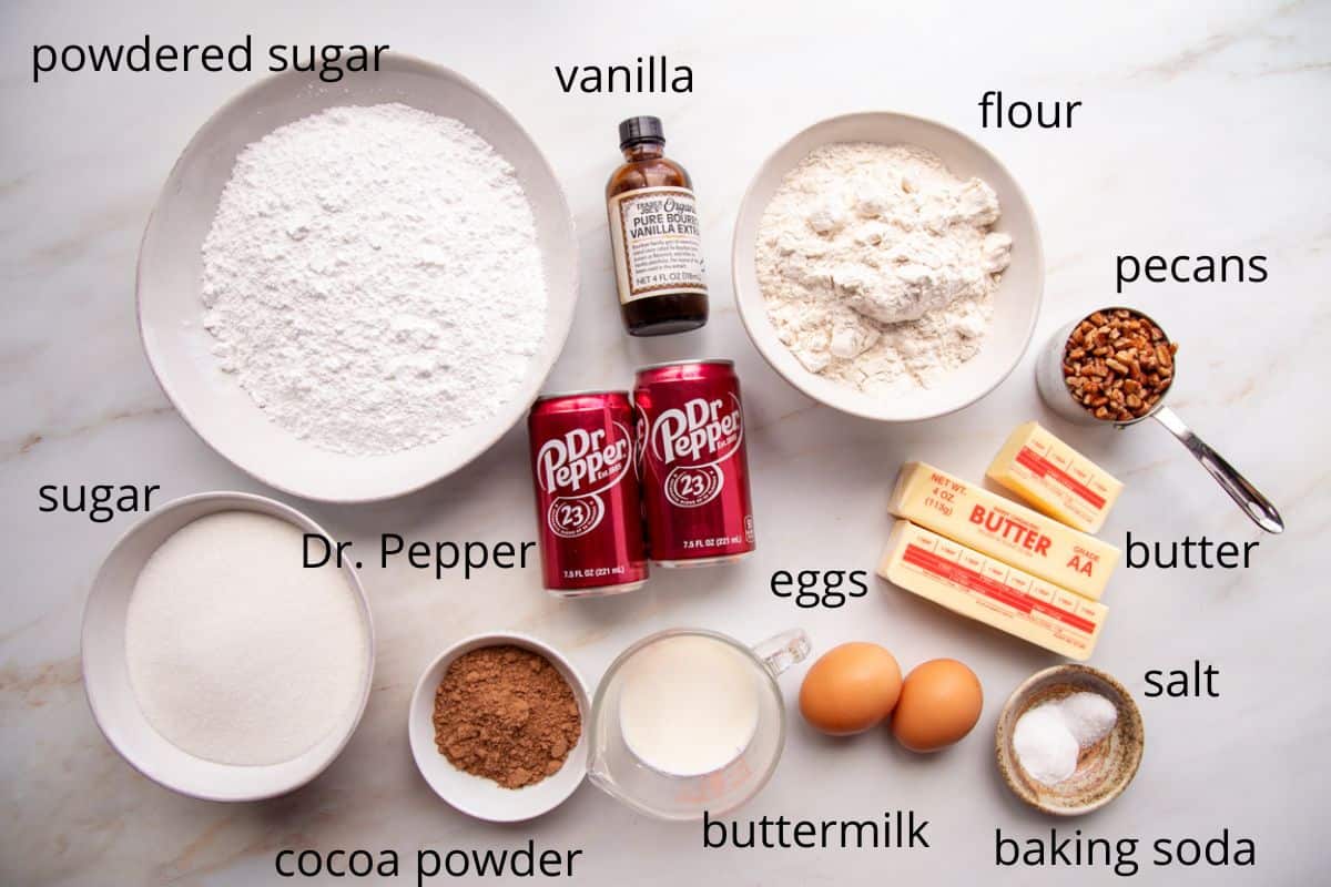 ingredients for dr. pepper cake on a white background.