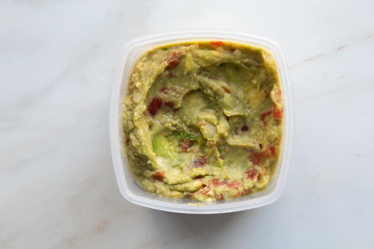 Rotel Guacamole in a small square plastic container.