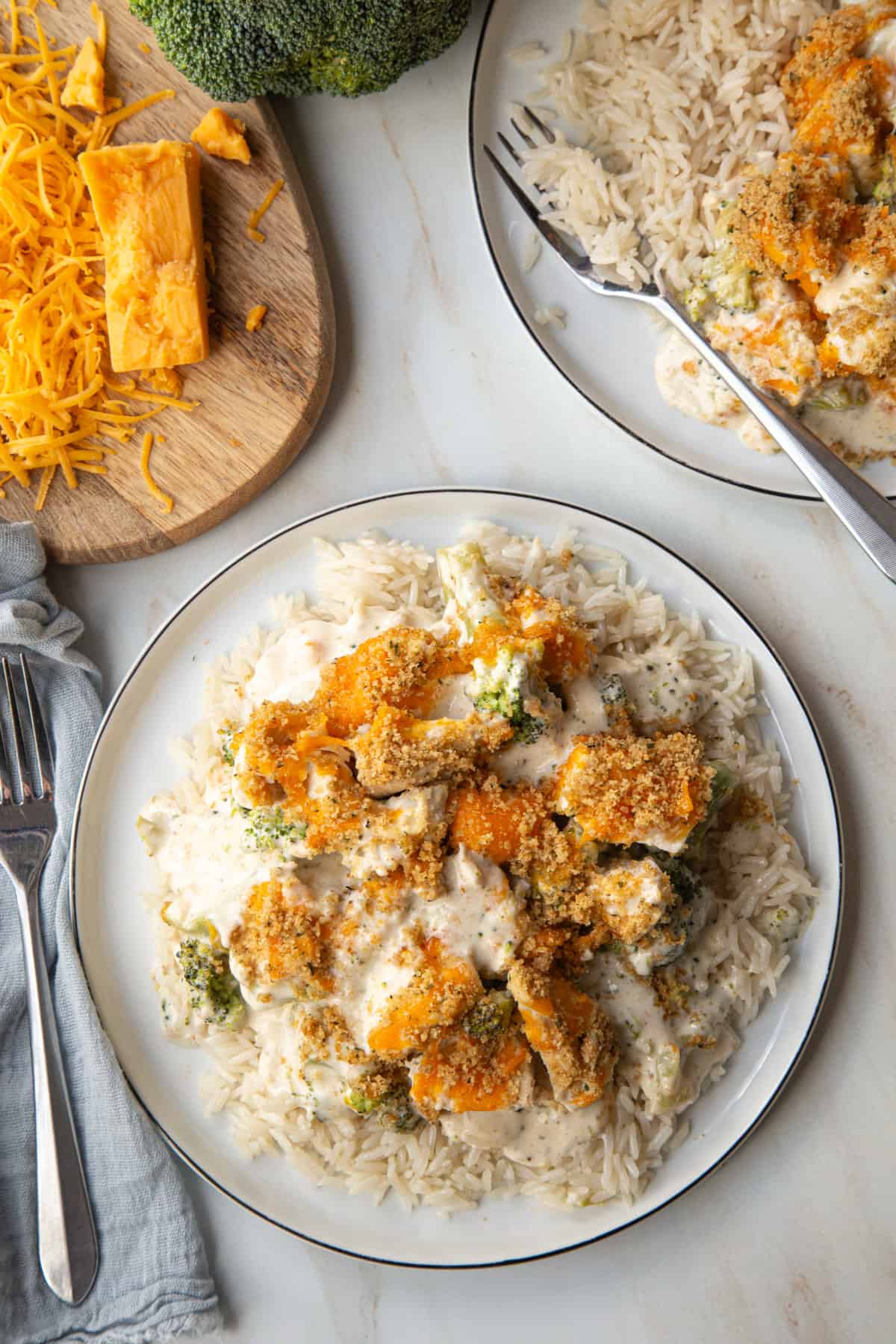 Nixon Chicken Casserole on a white plate next to another plate of casserole.