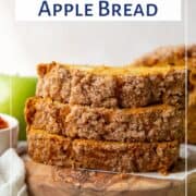 slices of pumpkin apple bread on a wooden board.