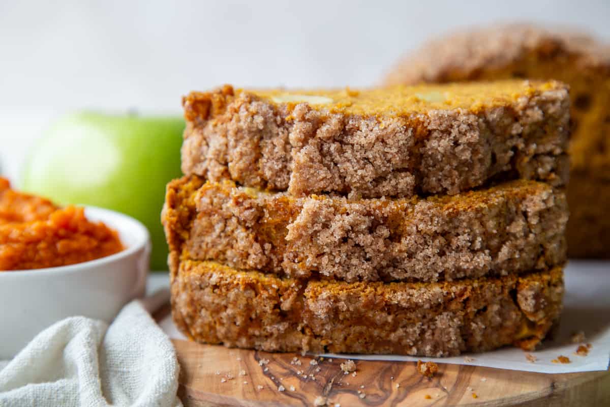 three slices of pumpkin apple bread stacked.