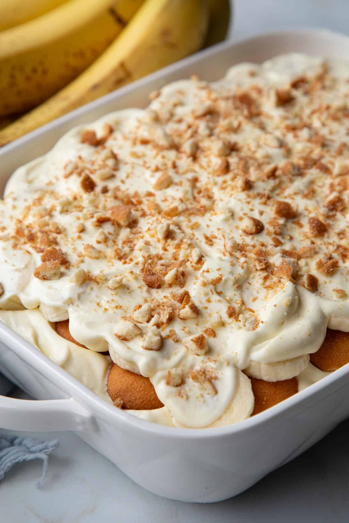 no cook banana pudding in a white baking dish.