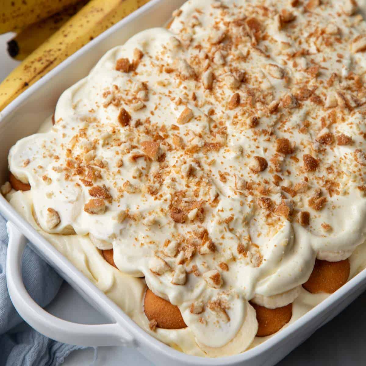 no cook banana pudding in a white baking dish.