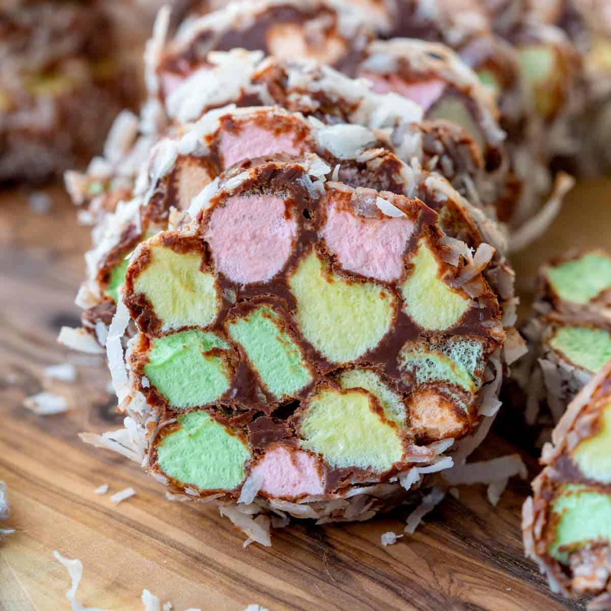 church window cookies rolled in coconut on a wooden board.